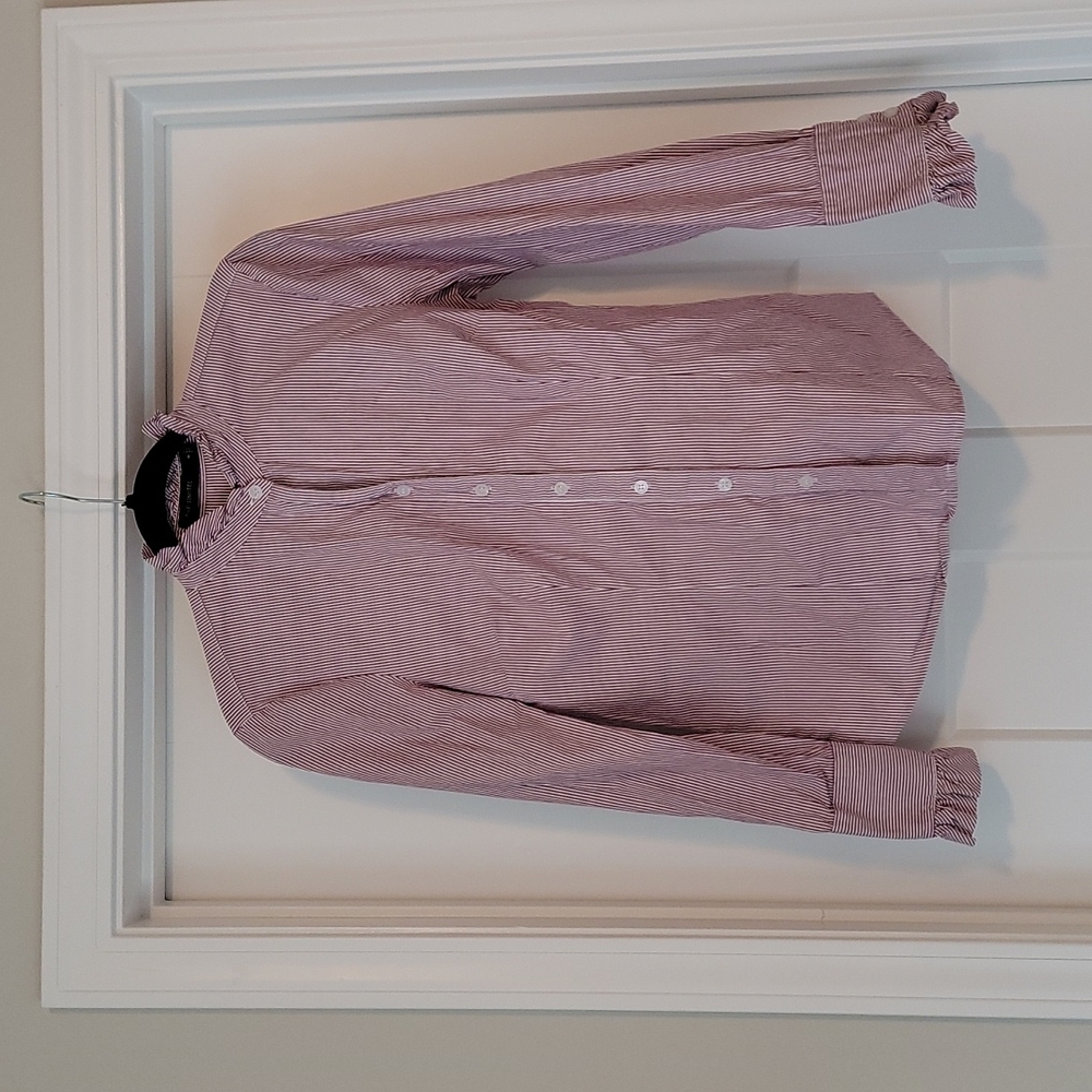 The limited striped ruffled blouse